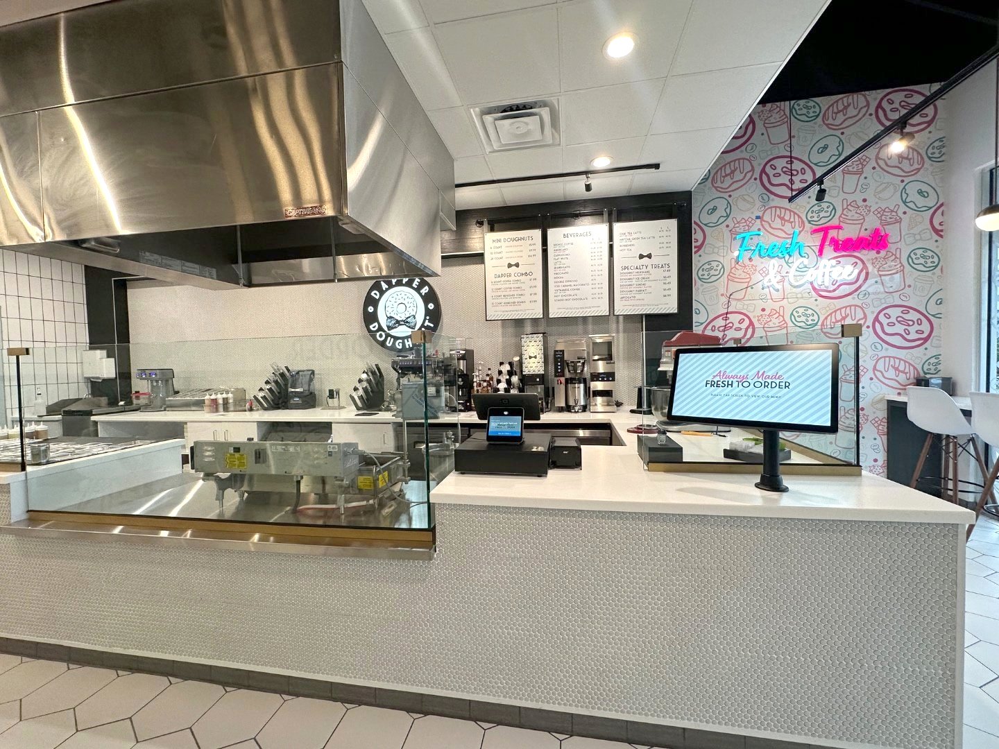 Inside a Dapper Doughnut shop — made-to-order mini doughnut counter and coffee bar.